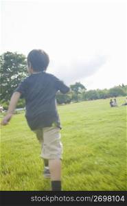 Boy running in the park