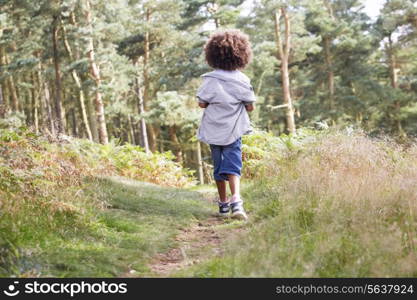 Boy Running Through Woods
