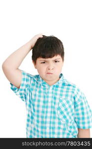 Boy scratches his head in puzzlement or confusion, as if pondering a deep question. Over white background.