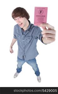 Boy showing driving licence