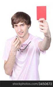 Boy showing red card