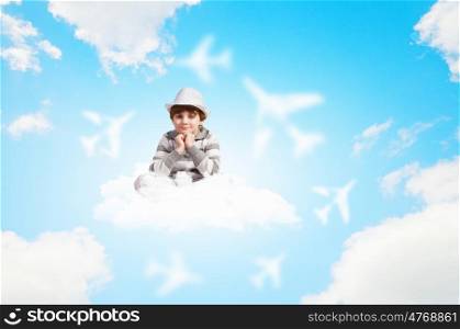 Boy sitting on cloud. Image of little cute boy smiling sitting on clouds