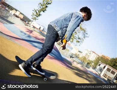 boy skateboarding park alone