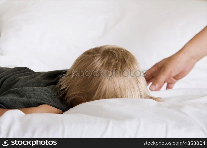 Boy sleeping on a bed