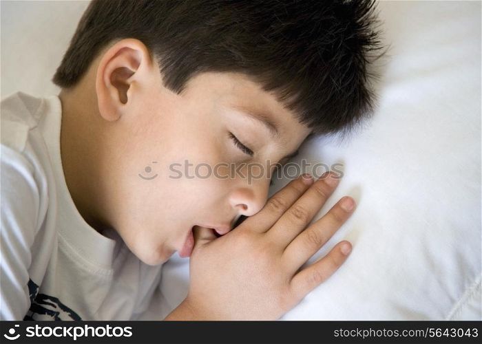 Boy sleeping with thumb in his mouth