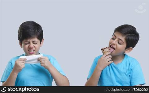 Boy sneezing and eating ice cream