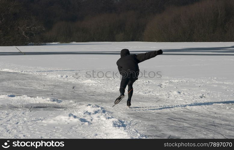 boy speedskating in winter in holland