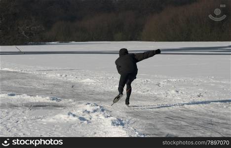 boy speedskating in winter in holland
