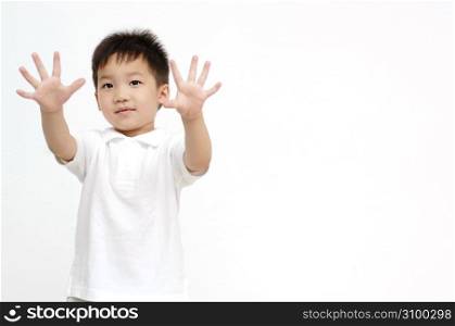 Boy spreading both hands