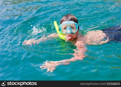 boy swims in the sea