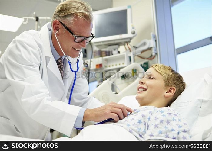 Boy Talking To Male Doctor In Emergency Room