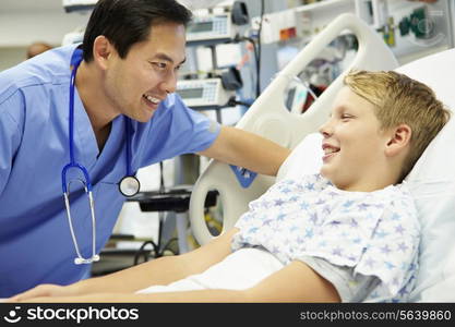 Boy Talking To Male Nurse In Emergency Room