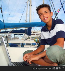 boy teen seat on boat marina laptop computer summer vacation