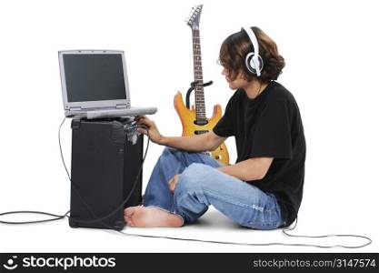 Boy Teenager With Electric Guitar Amp And Laptop.