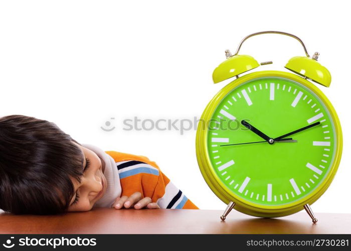 Boy tired of study and sleeping near the clock