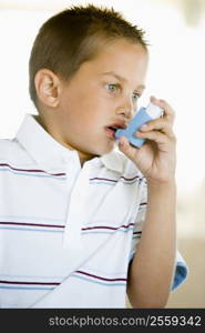 Boy Using An Inhaler