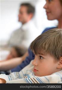 Boy Watching TV with Parents