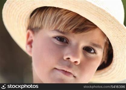Boy wearing a straw hat