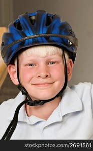 Boy wearing bicycle helmet, close-up, portrait