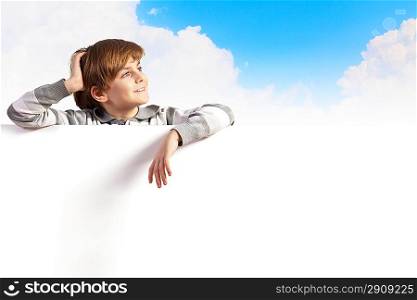 Boy with a blank billboard