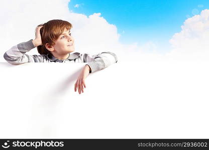 Boy with a blank billboard