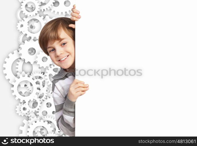 Boy with a blank billboard. Little boy holding a blank white billboard