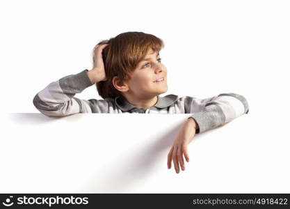 Boy with a blank billboard. Little boy holding a blank white billboard