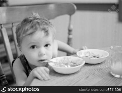 Boy with a bowl and spoon