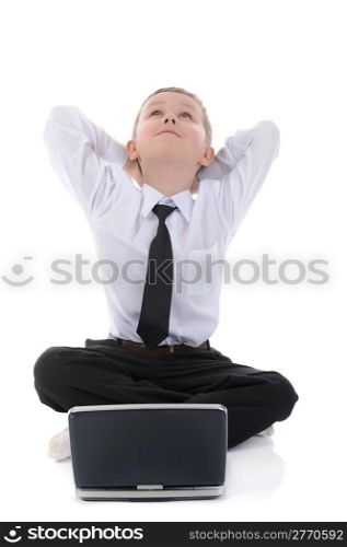boy with a laptop sitting on the floor. Isolated on white background