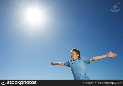 Boy With Arms Outstretched