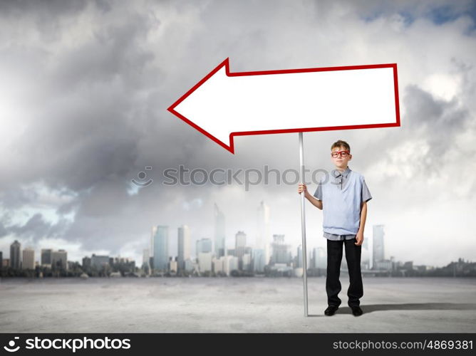 Boy with banner. Boy of school age in glasses holding blank banner