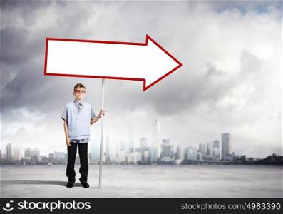 Boy with banner. Boy of school age in glasses holding blank banner