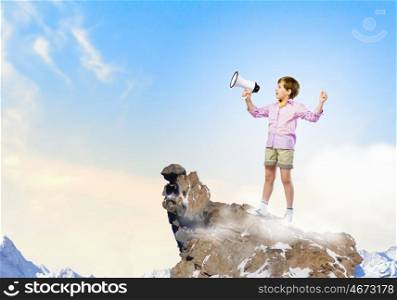 Boy with flute. Image of little cute boy shouting in megaphone