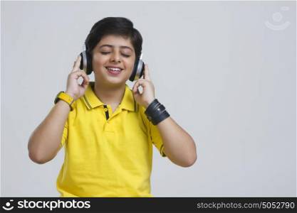 Boy with headphones listening to music