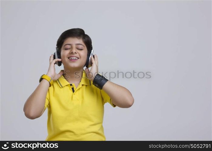 Boy with headphones listening to music