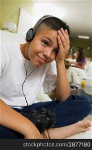 Boy with Headphones Playing Video Game