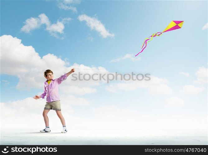 Boy with kite. Little boy playing with kite. Childhood concept
