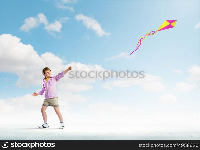 Boy with kite. Little boy playing with kite. Childhood concept