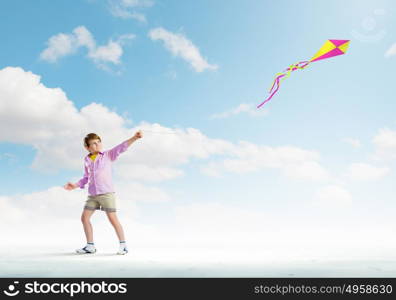 Boy with kite. Little boy playing with kite. Childhood concept