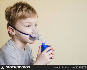 boy with oxygen mask