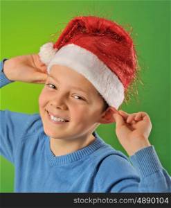 boy with Santa Claus Hat on green background, shoot in studio
