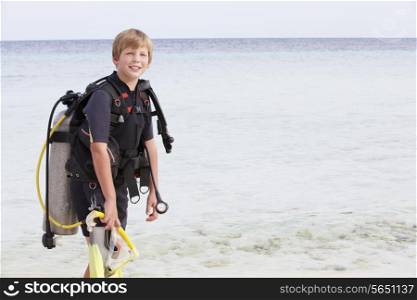 Boy With Scuba Diving Equipment Enjoying Beach Holiday