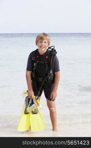 Boy With Scuba Diving Equipment Enjoying Beach Holiday