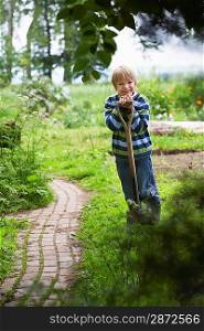 Boy with Shovel in Garden