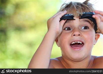 Boy with swimming goggles