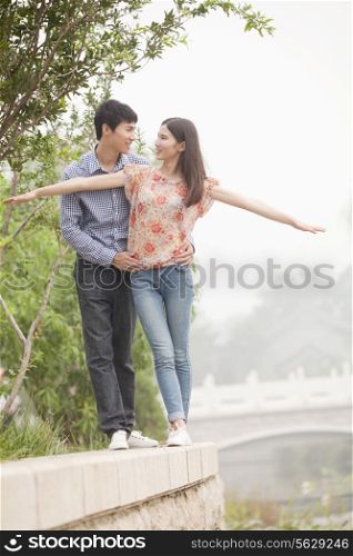 Boyfriend and Girlfriend by a Canal