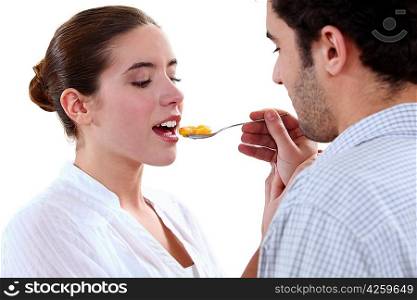 boyfriend feeding his girlfriend