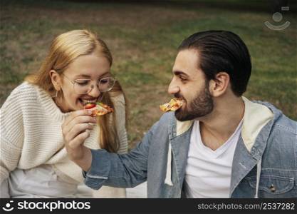 boyfriend girlfriend eating pizza