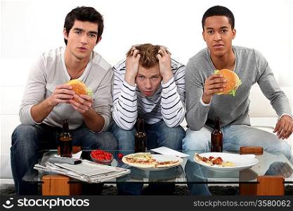 Boys eating burgers