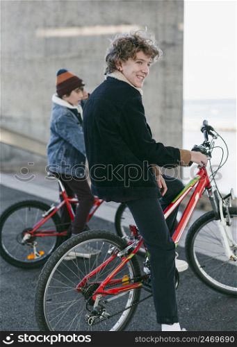 boys outdoors city with their bikes